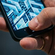 Hand_pressing_smartphone_202604141749